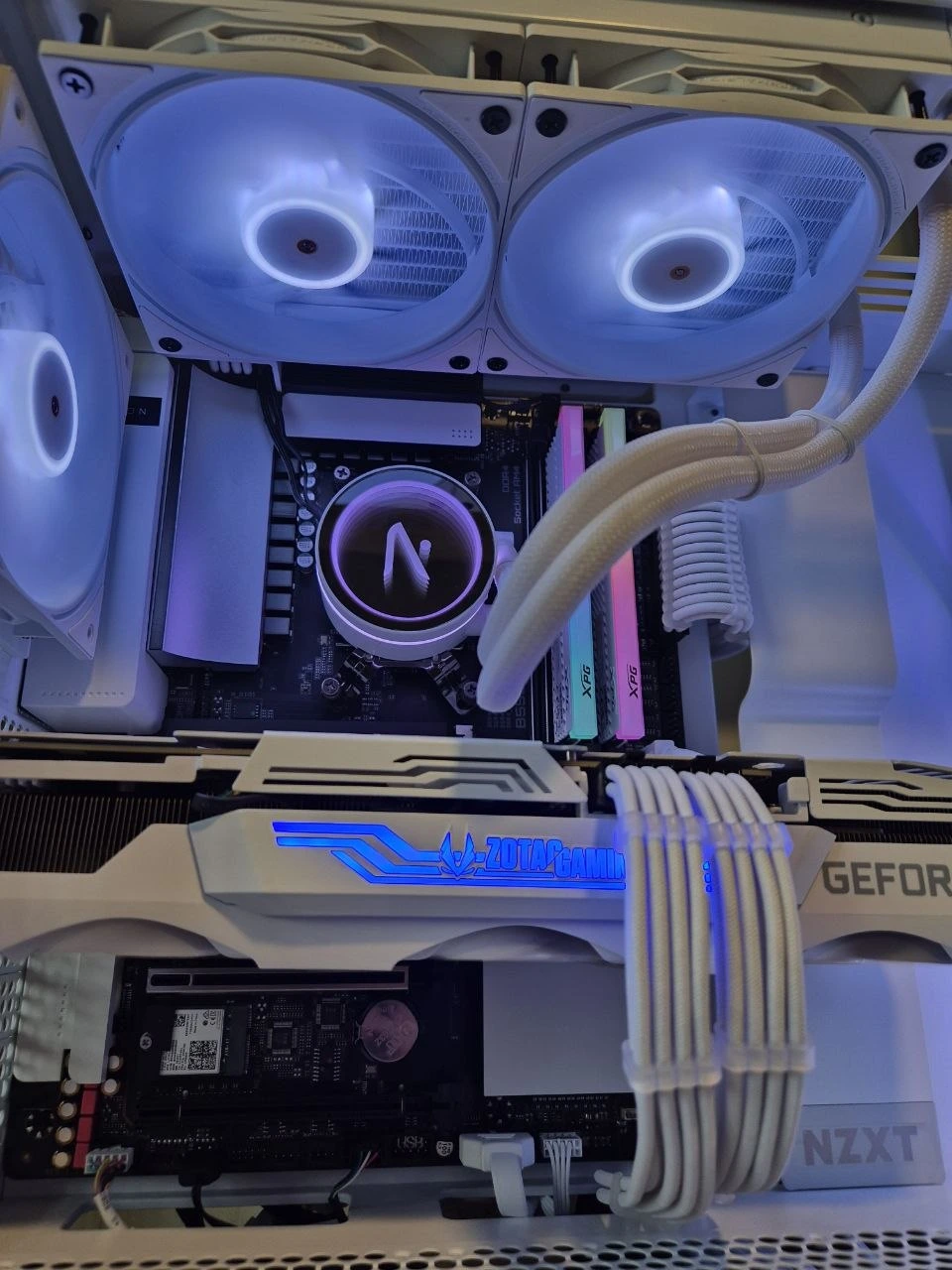 Close-up of memory, graphics card and cooling inside a white desktop