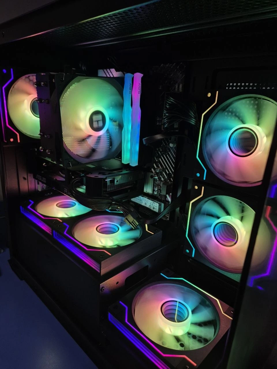 Deep purple RGB fan glow inside a gaming desktop in Singapore