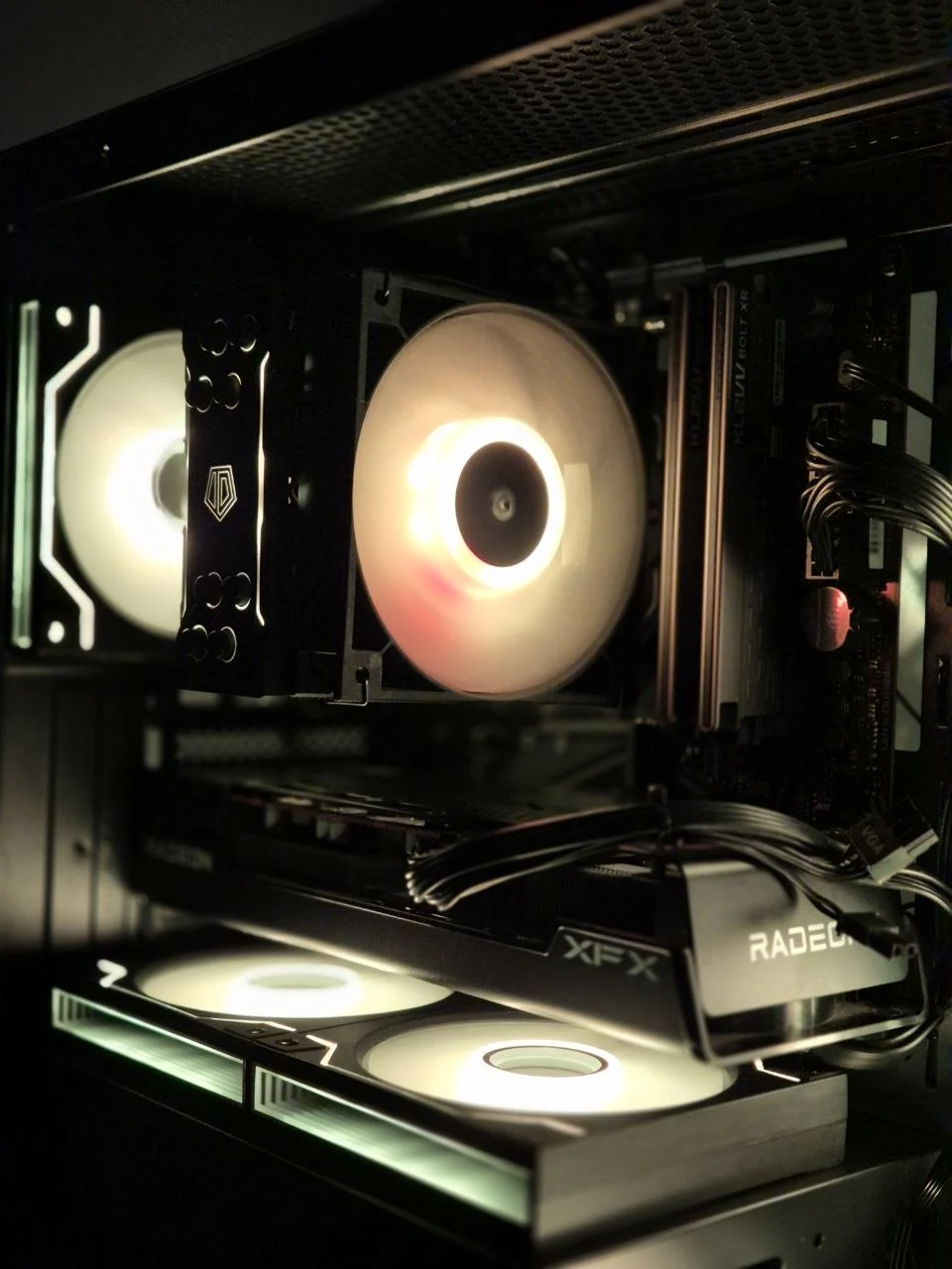 Black desktop with warm white illuminated fans
